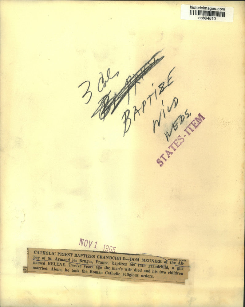 1965 Press Photo Dom Meunier of St. Armand le Bruges baptizes his grandchild