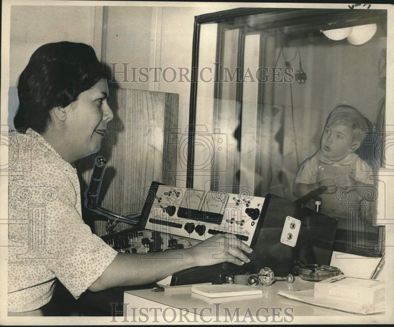 Load image into Gallery viewer, 1967 Press Photo New Orleans-Frances M. Billeaud checks John Bell IV's hearing
