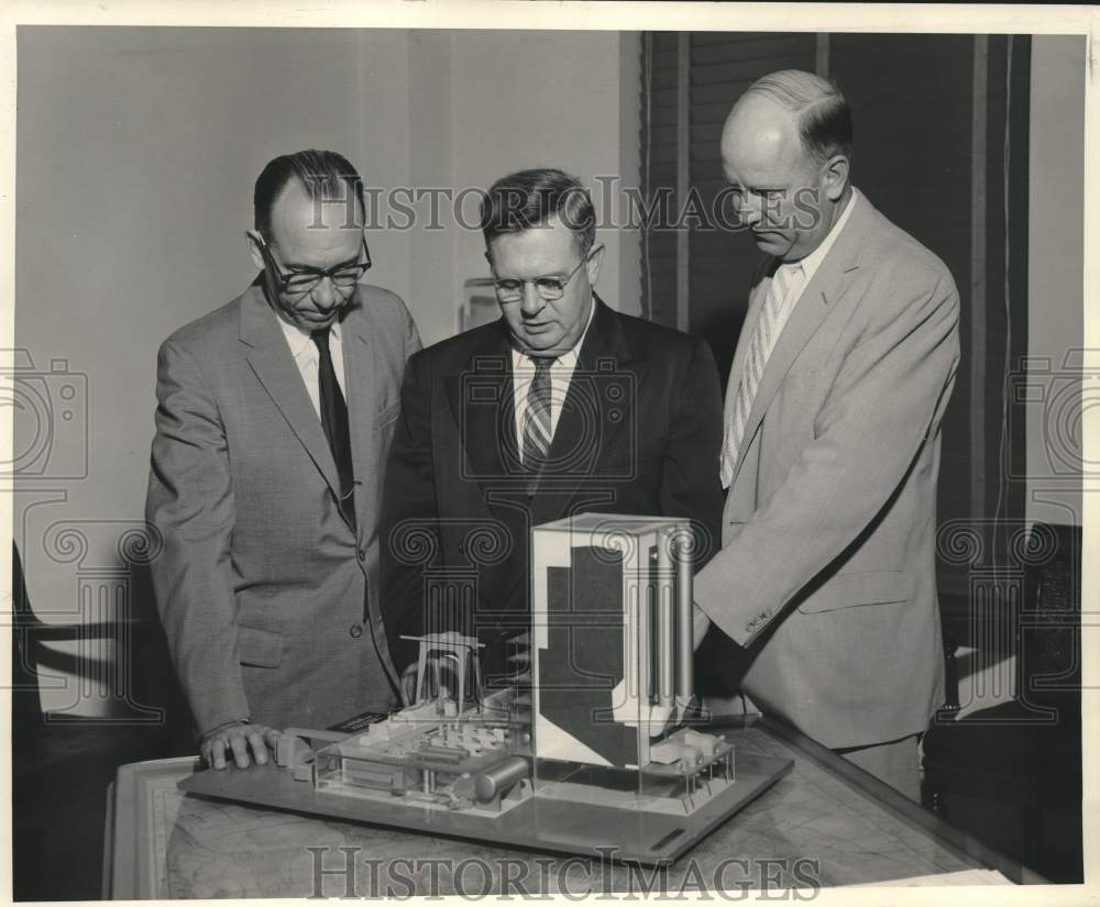 1958 Press Photo Looking over model of Michoud Steam-Electric Generating Station