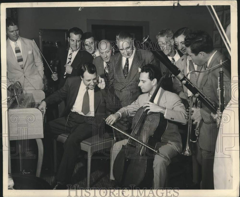 Load image into Gallery viewer, 1948 Press Photo Oil Geologist Gordon Atwater with First Cellist Adrian Geoffrey
