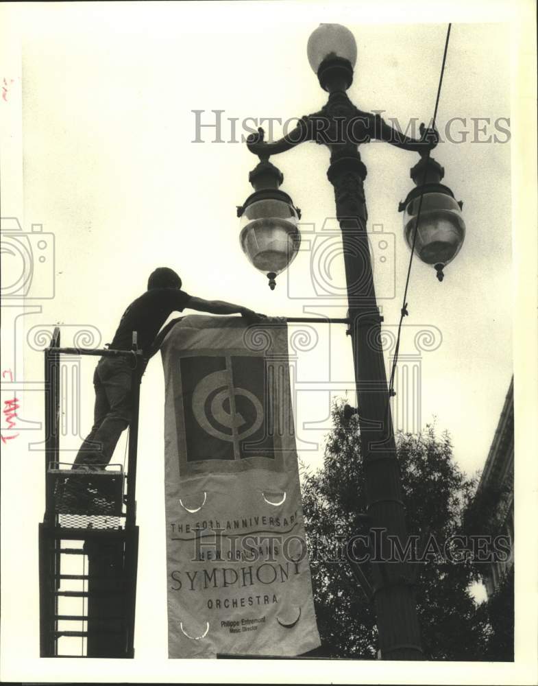 Load image into Gallery viewer, 1985 Press Photo New Orleans Philharmonic Symphony banner at Canal Street
