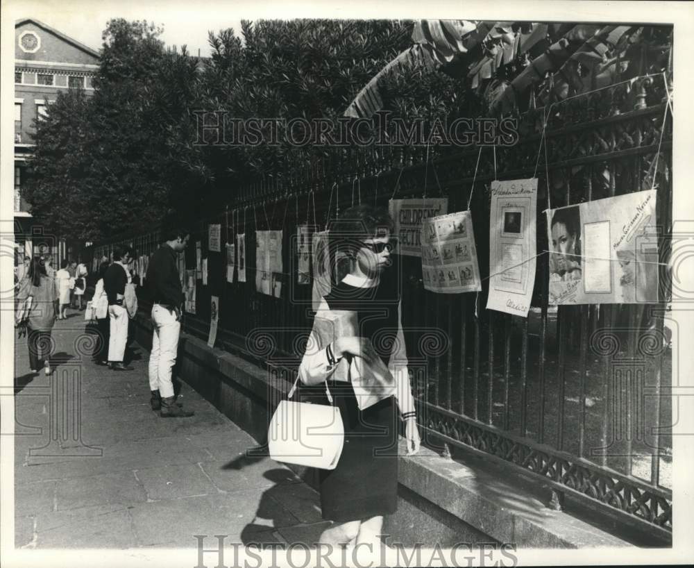 1968 Press Photo Visitors look at wall posters at Poetry Jackson Square Show