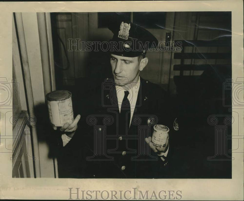 Load image into Gallery viewer, 1949 Press Photo Patrolman C. F. Neidermier Examines Cans Of Paint - nob98659
