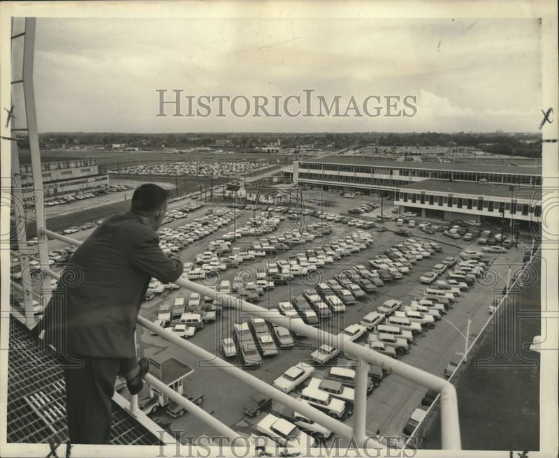 Load image into Gallery viewer, 1959 Press Photo Man Views Parking Lot, Moisant International Airport
