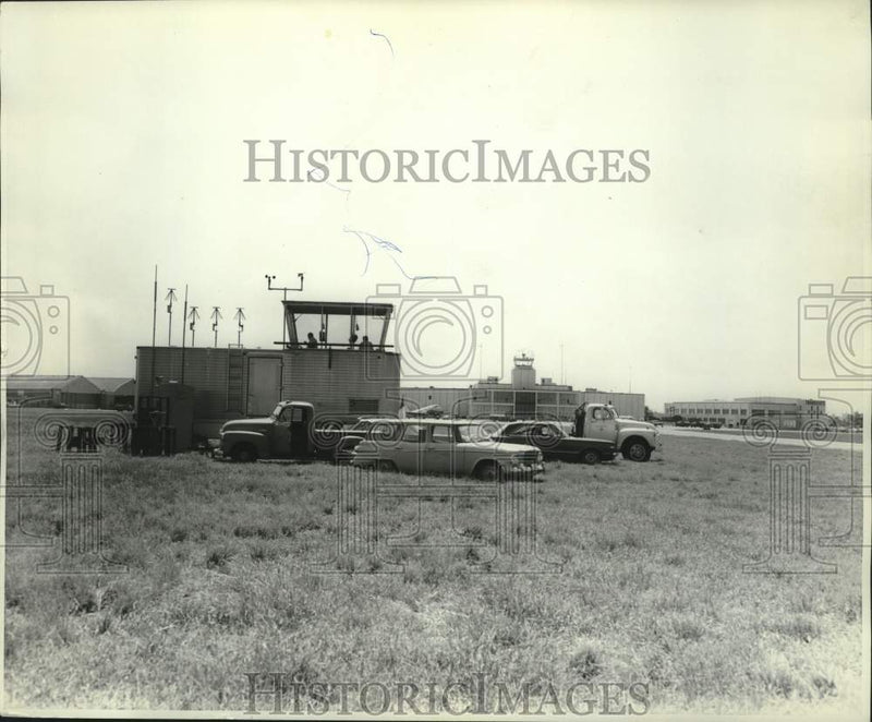 Load image into Gallery viewer, 1966 Press Photo Vehicles Parked Near Control Tower, New Orleans Airport
