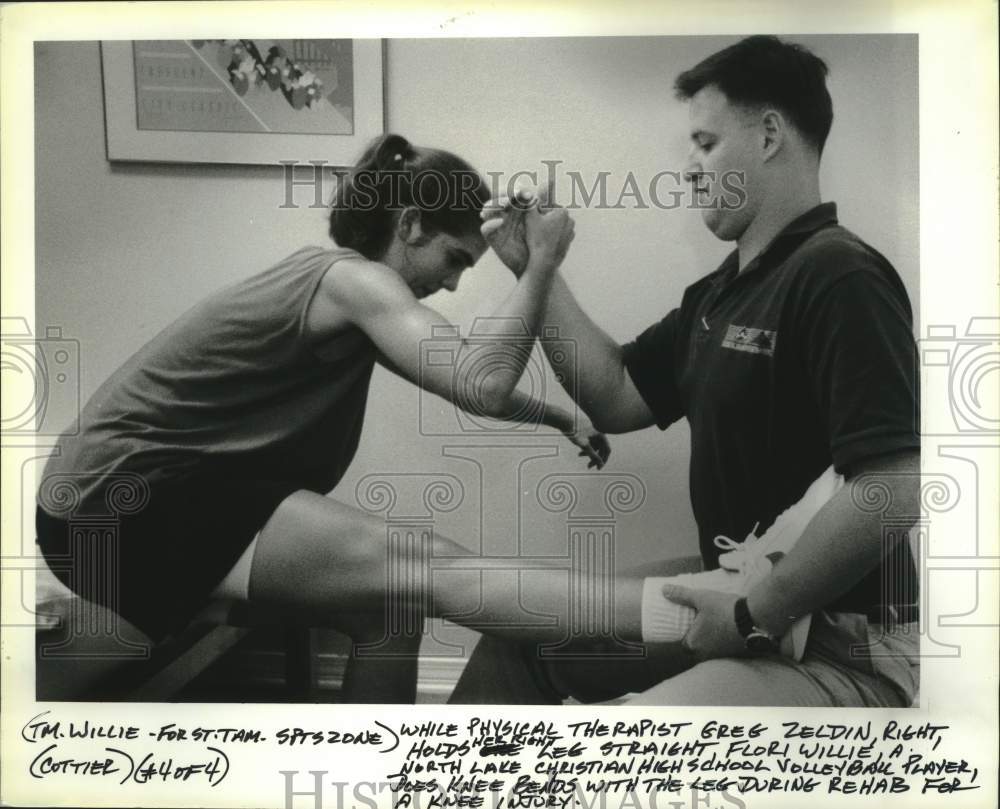 Press Photo Physical Therapist Works On High School Volleyball Player&#39;s Knee- Historic Images