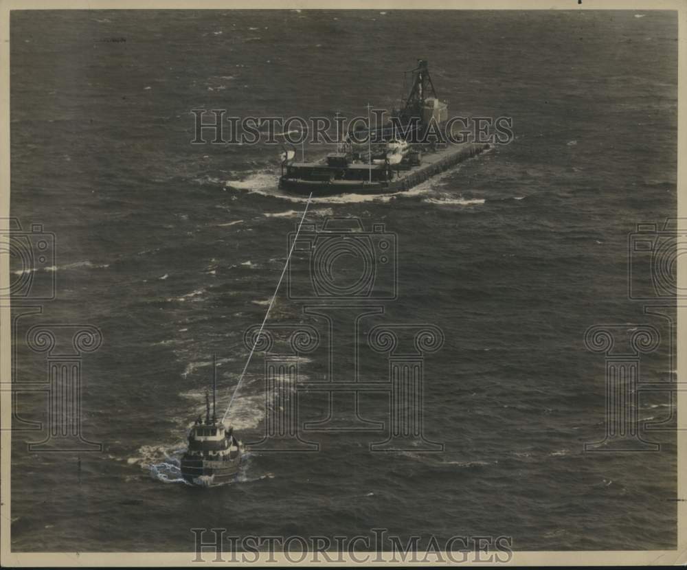 1956 Press Photo Tugboat Towing Huge Derrick Barge in Gulf of Mexico - noc00703
