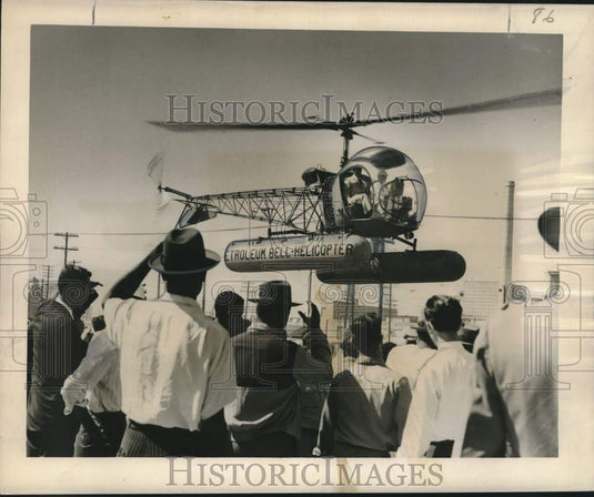 1950 Press Photo Helicopter Hovers at Oil Progress Week Event, Louisiana
