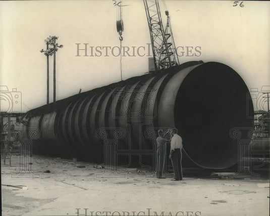 1960 Press Photo Oil- giant pipeline equipment being inspected- Historic Images