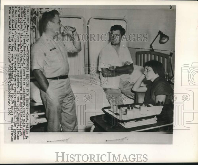 Load image into Gallery viewer, 1960 Press Photo Honeymooners Rescued From Nevada Desert by Capt. Philip Maggart
