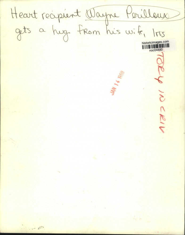 1988 Press Photo Heart recipient Wayne Perilloux gets a hug from his wife, Iris