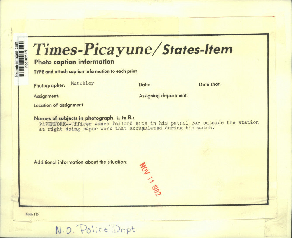 1982 Press Photo Officer James Pollard doing paper work in his patrol car