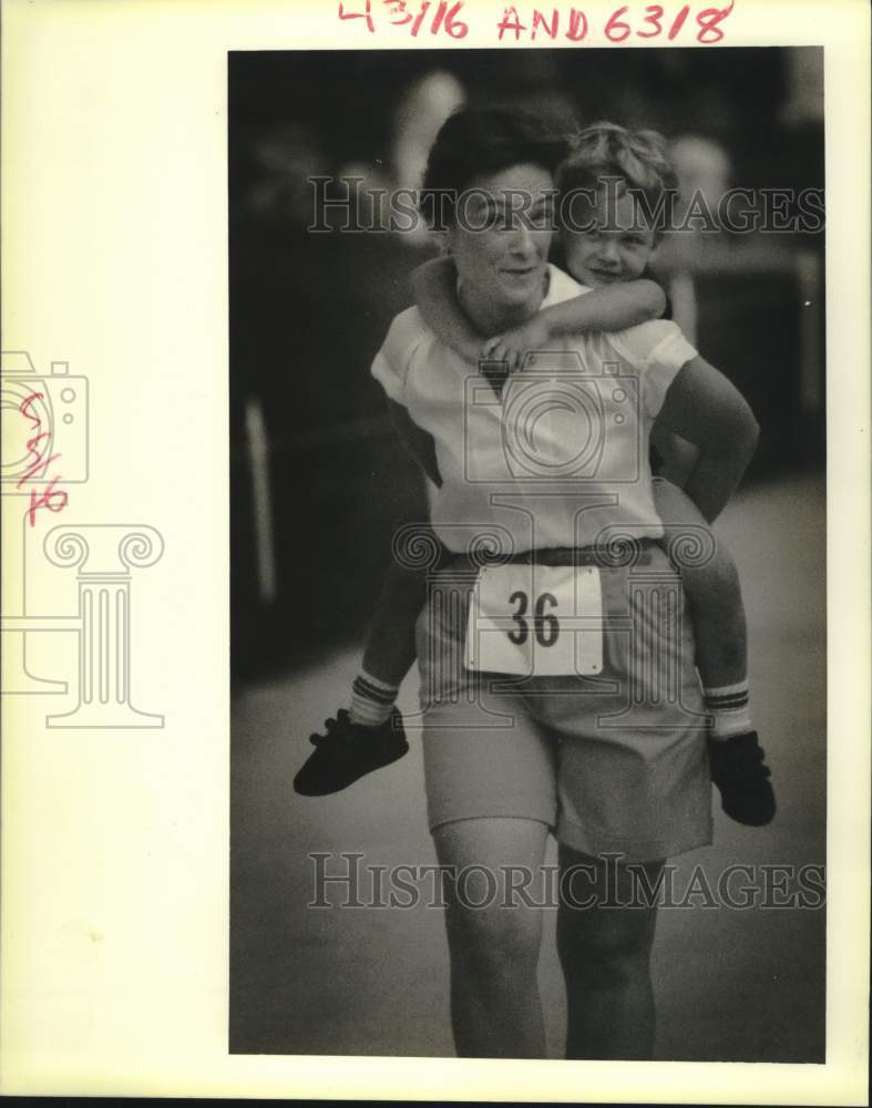 1988 Press Photo Mother & son finish race in Slidell Louisiana - noc08749- Historic Images