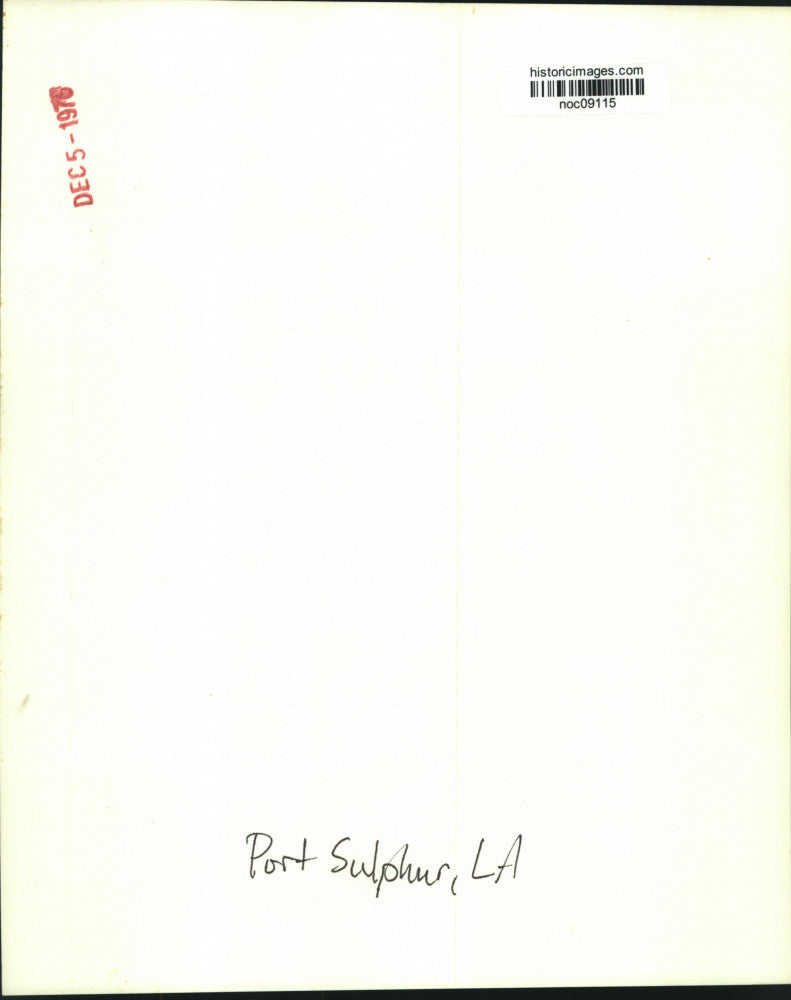 1976 Press Photo Man walks along pipes at Port Sulphur, Louisiana - noc09115