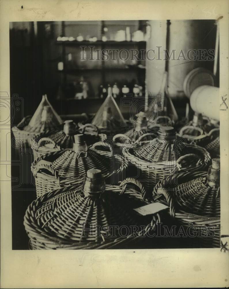 1961 Press Photo Wicker Baskets Used to Store Bottled Essemces - noc12719