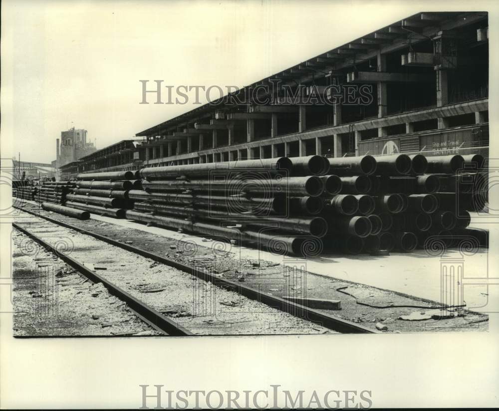 1973 Press Photo Venezuelan Oil Pipes Stacked on Street Behind Wharf B Dock