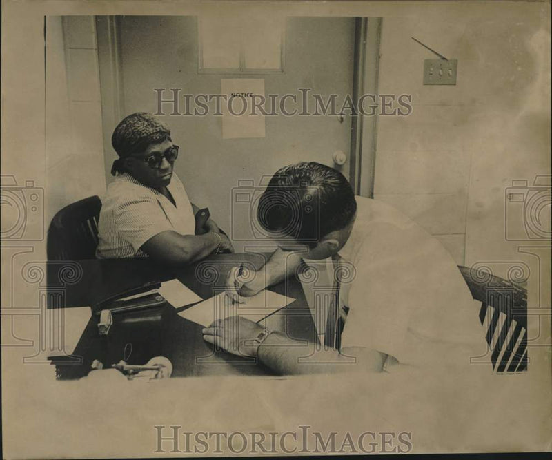 Load image into Gallery viewer, 1965 Press Photo Voter registration clerk helps woman apply in Louisiana
