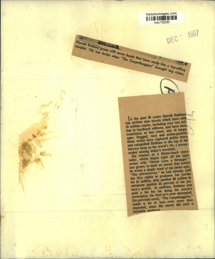 1967 Press Photo Author Harold Robbins Sits Next To Seven Top-Selling Books