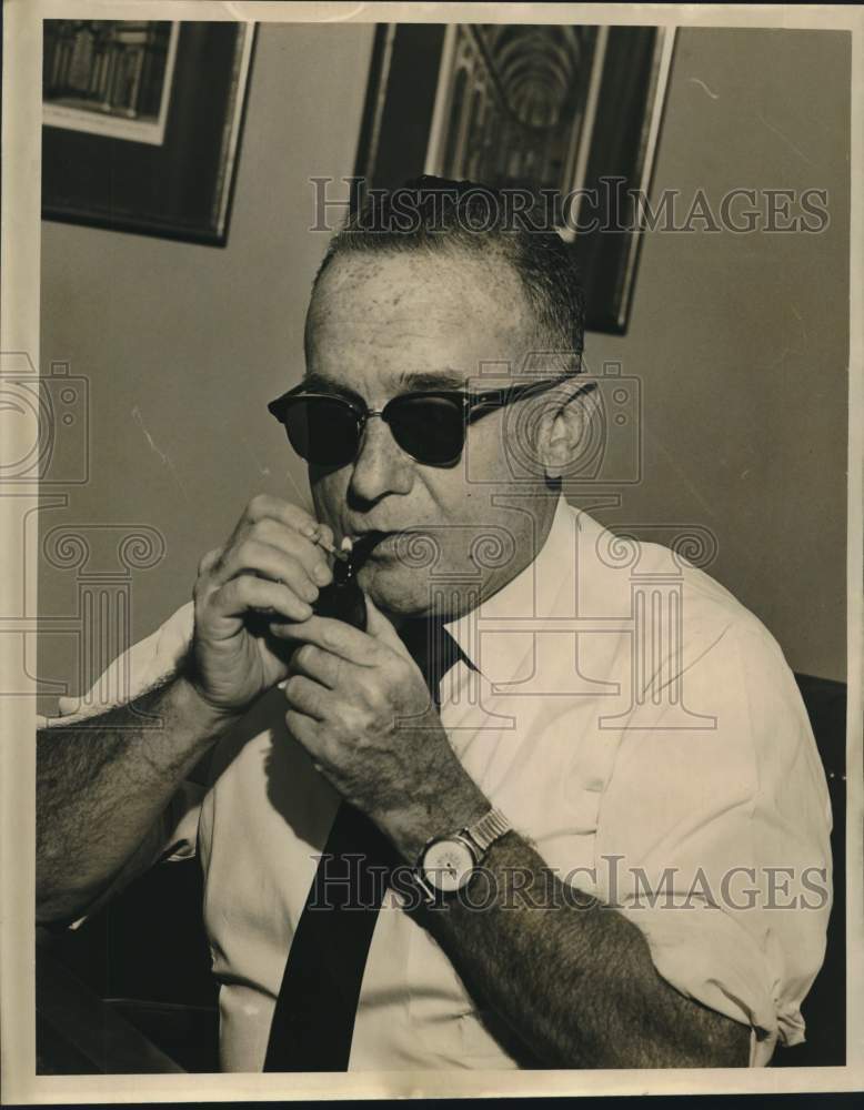 1965 Press Photo Victor Riesel, Labor Columnist, Lights his Pipe - noc17415- Historic Images