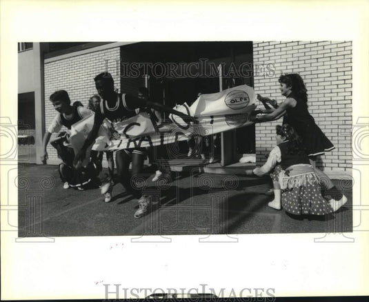 1990 Press Photo Our Lady of Perpetual Help Pep Rally, Basketball Players run- Historic Images