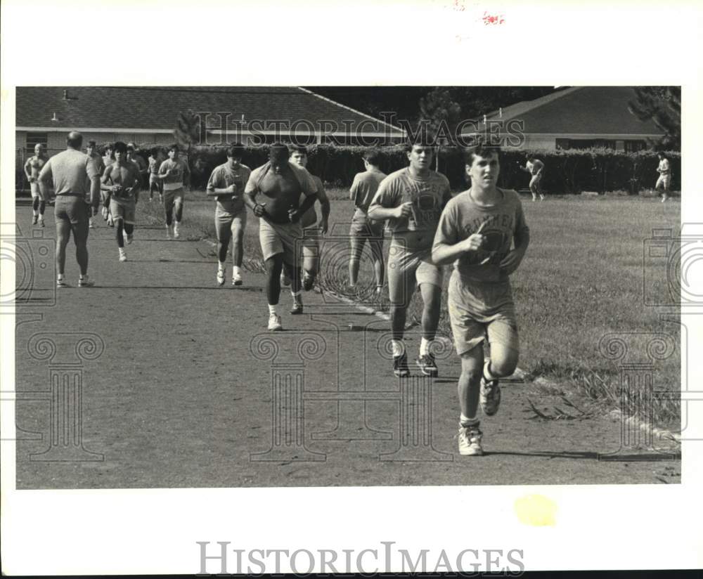 1989 Press Photo Rummel High School Football Team Running through Spring Drills- Historic Images