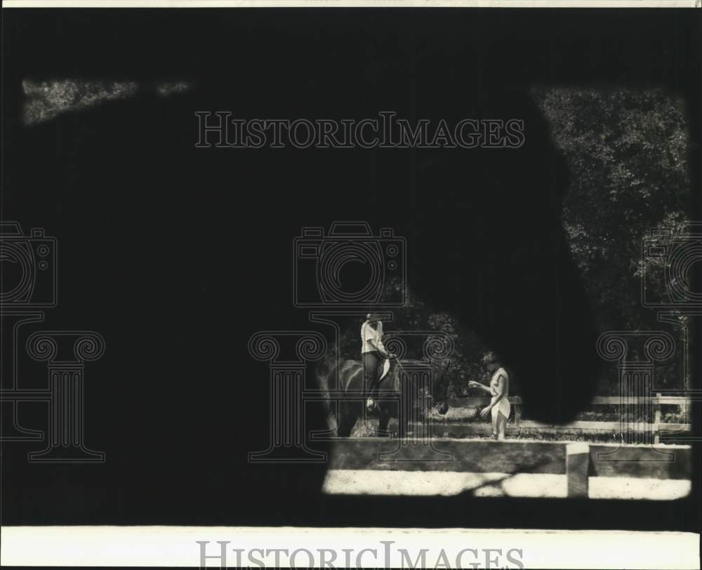 1980 Press Photo Cornelia Quinn and student practice horse riding. - noc22563- Historic Images