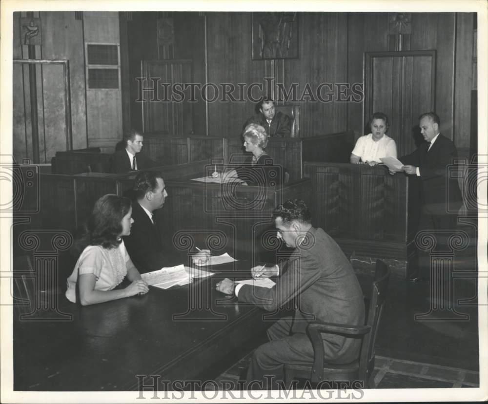 1962 Press Photo Financier&#39;s secretary, lower left, on trial for murder.
