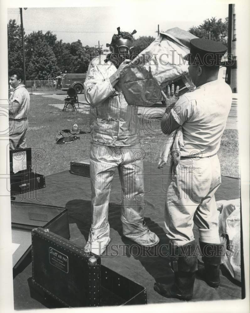 Load image into Gallery viewer, 1961 Press Photo Jack Kieffer helps Lt. Henry Engelbracht - Flame Safety Suit
