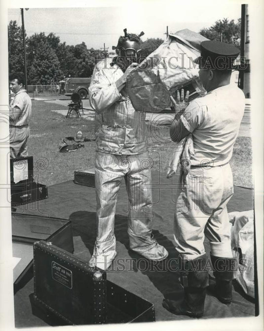 1961 Press Photo Jack Kieffer helps Lt. Henry Engelbracht - Flame Safety Suit