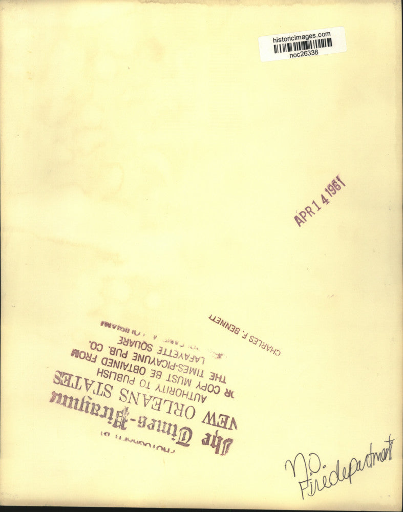 1961 Press Photo New Orleans Fire Department firemen stand on fire engine