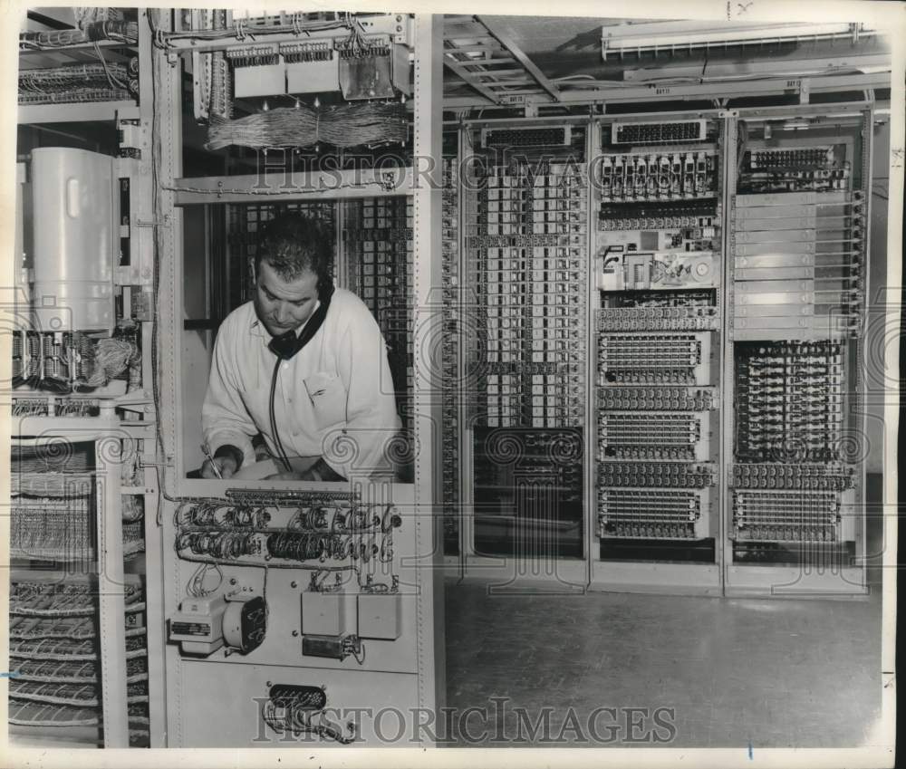1957 Press Photo E.J. Dupuy, Jr. checks communication equipment in New Orleans