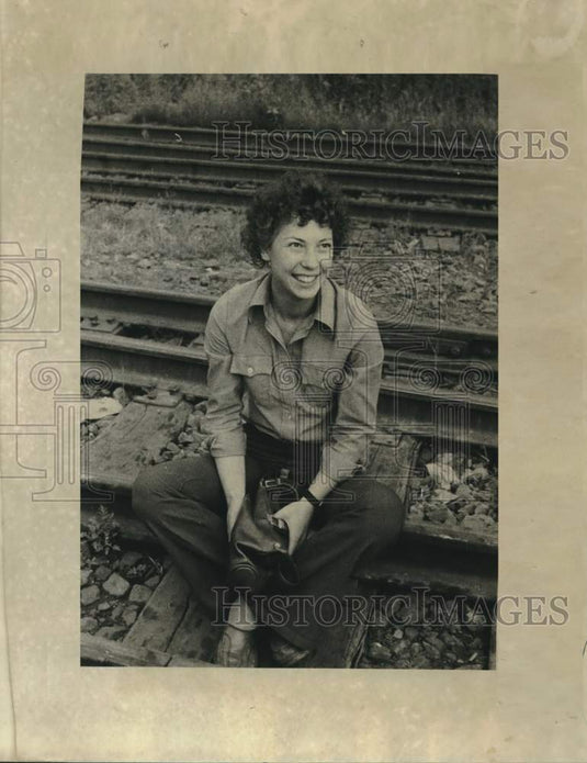 1977 Press Photo Kira smiles from the tracks of the Siberian Railroad