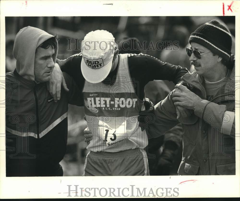 1985 Press Photo Running - A contestant gets help after running- Historic Images