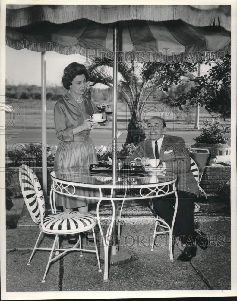 Load image into Gallery viewer, 1962 Press Photo Mayor Victor Schiro and wife Sunny have coffee on patio.
