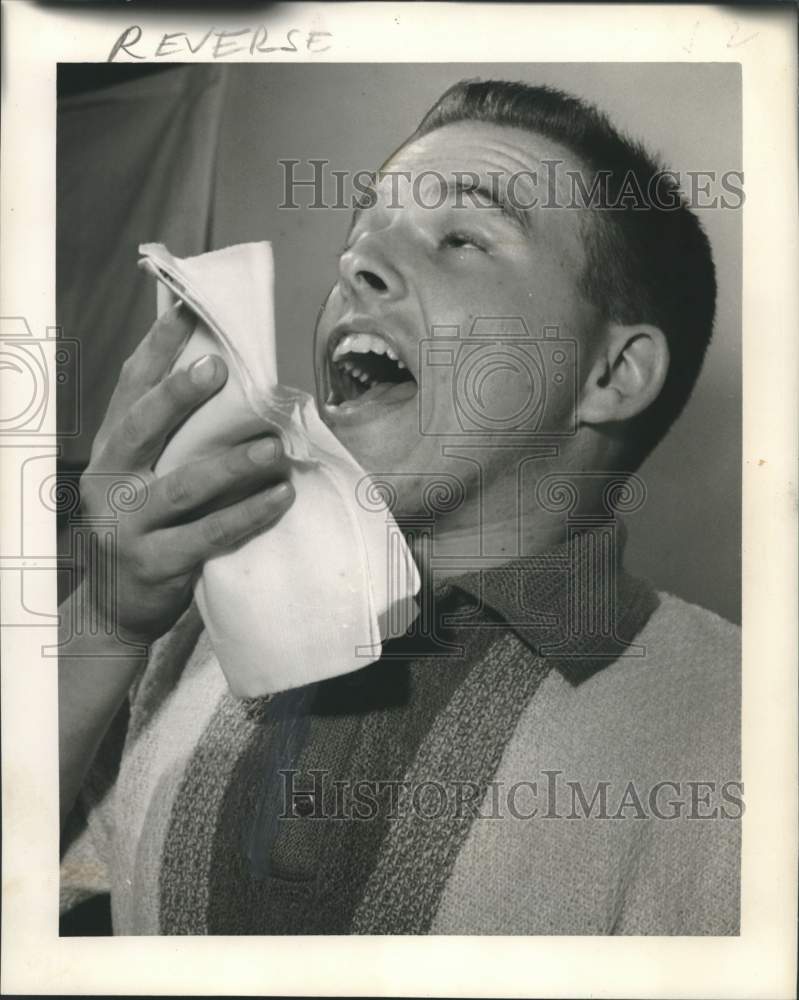 Load image into Gallery viewer, 1964 Press Photo Paul Patterson's sneezing due to allergies - noc33433
