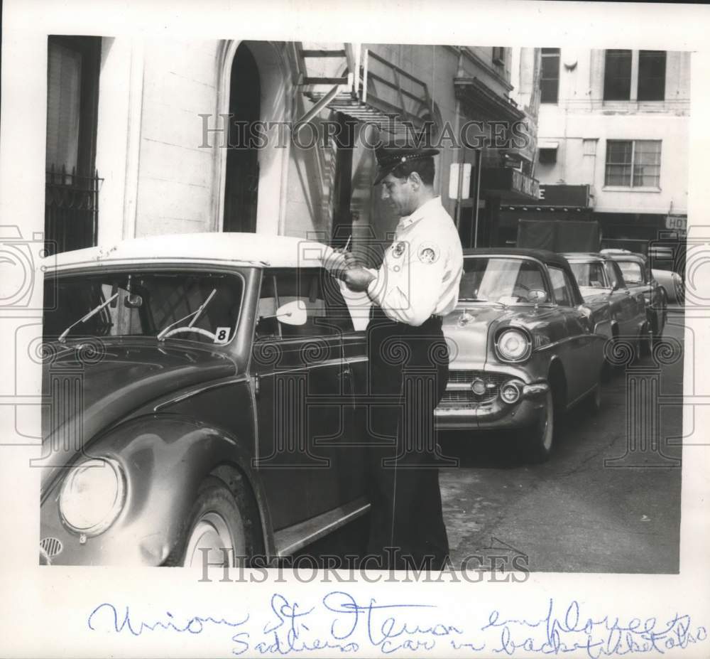 1957 Press Photo Officer Frank Fortuna writes parking tickets on Union Street