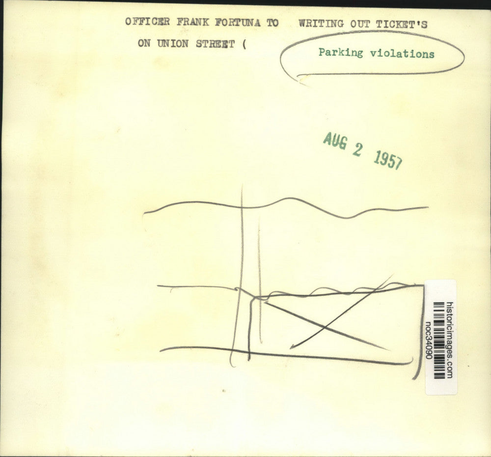 1957 Press Photo Officer Frank Fortuna writes parking tickets on Union Street