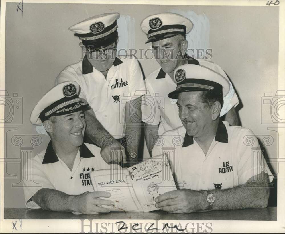 1966 Press Photo Officers of Lafitte Yacht Club look at pirogue races program