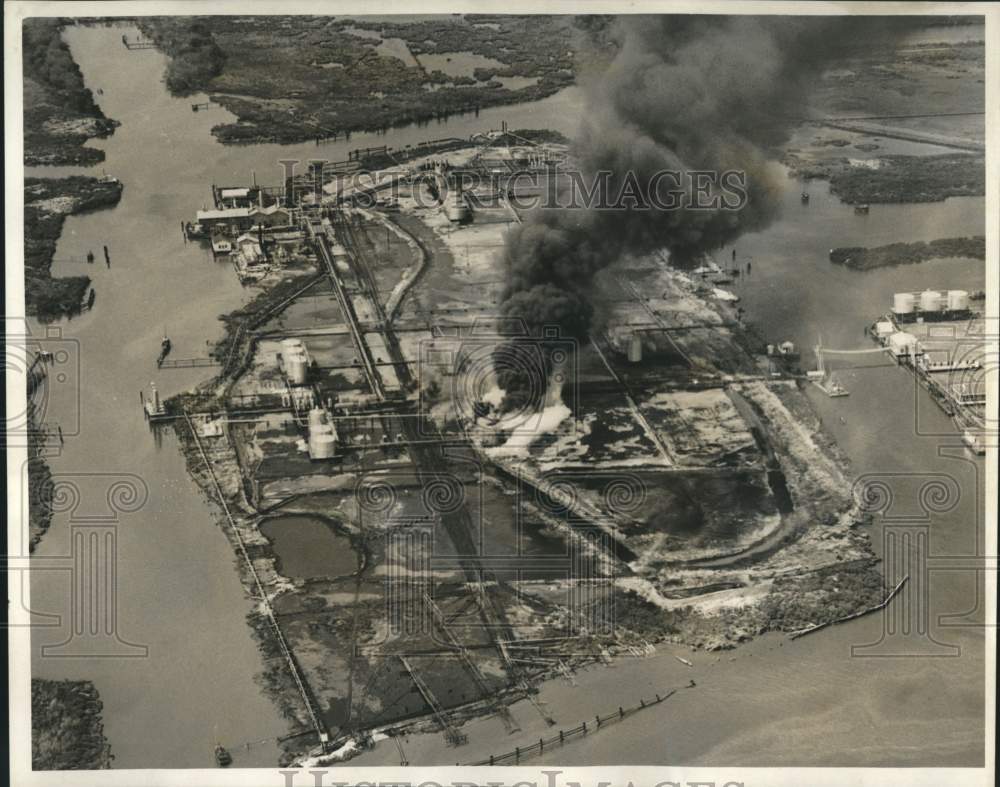 1964 Press Photo Fire damaged oil wells on Production Island at Dupre Cut