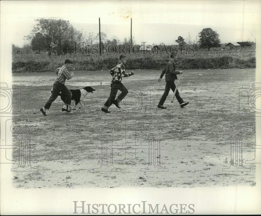 1961 Press Photo Young boys and dog playing in Sandersville, Mississippi