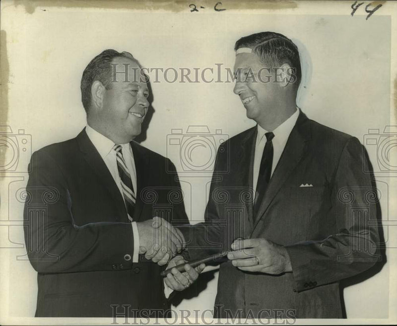 Load image into Gallery viewer, 1967 Press Photo Mike Weaver Sr. congratulates Carl F. Scudder as GMRA president
