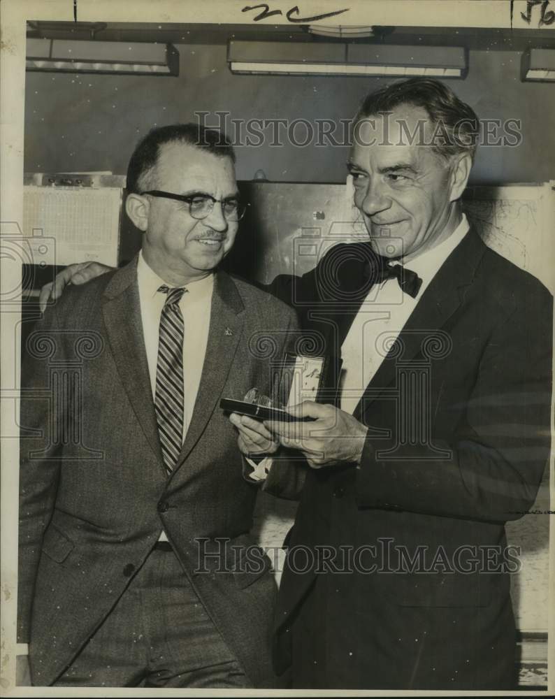Load image into Gallery viewer, 1962 Press Photo New Orleans weatherman Ralph Sanders retires, presented watch.
