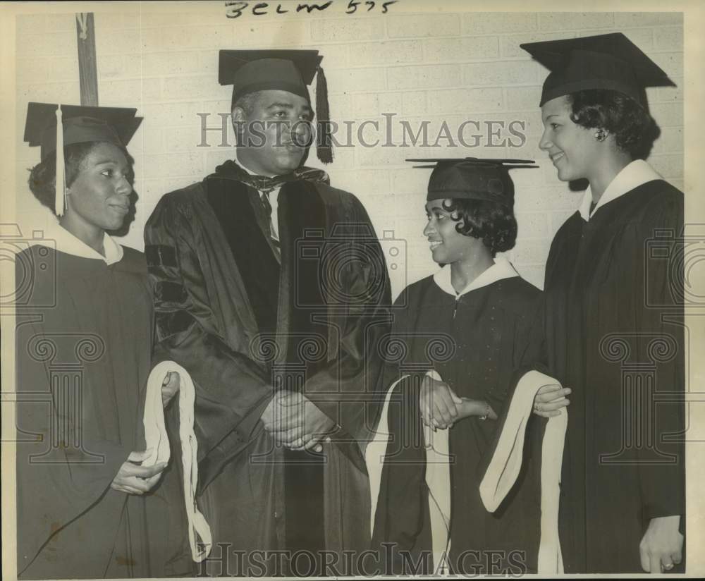 1964 Press Photo Dr. Whitney M. Young Jr. chats with Xavier University graduates