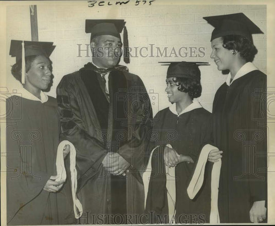 1964 Press Photo Dr. Whitney M. Young Jr. chats with Xavier University graduates