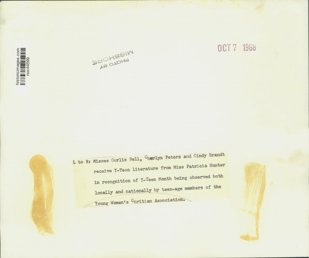 1968 Press Photo Teens receive literature from YWCA for Y-Teen Month - noc44599