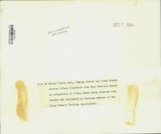 1968 Press Photo Teens receive literature from YWCA for Y-Teen Month - noc44599