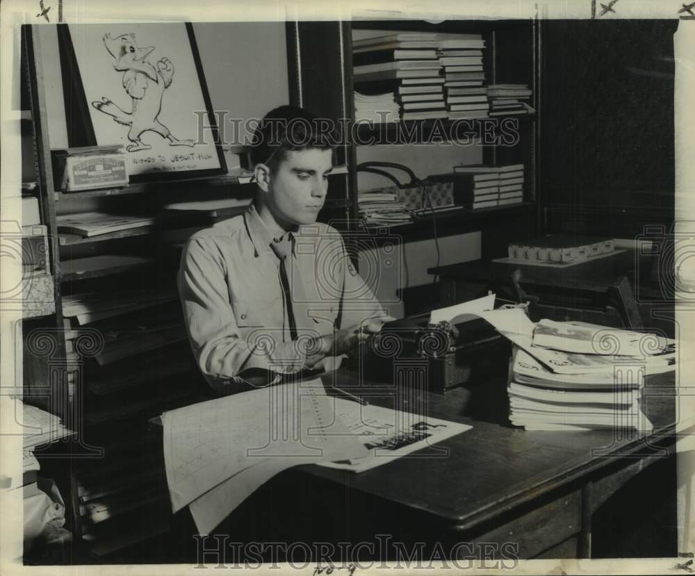 1956 Press Photo Jesuit High sports editor Robert Winn types story - noc48930- Historic Images