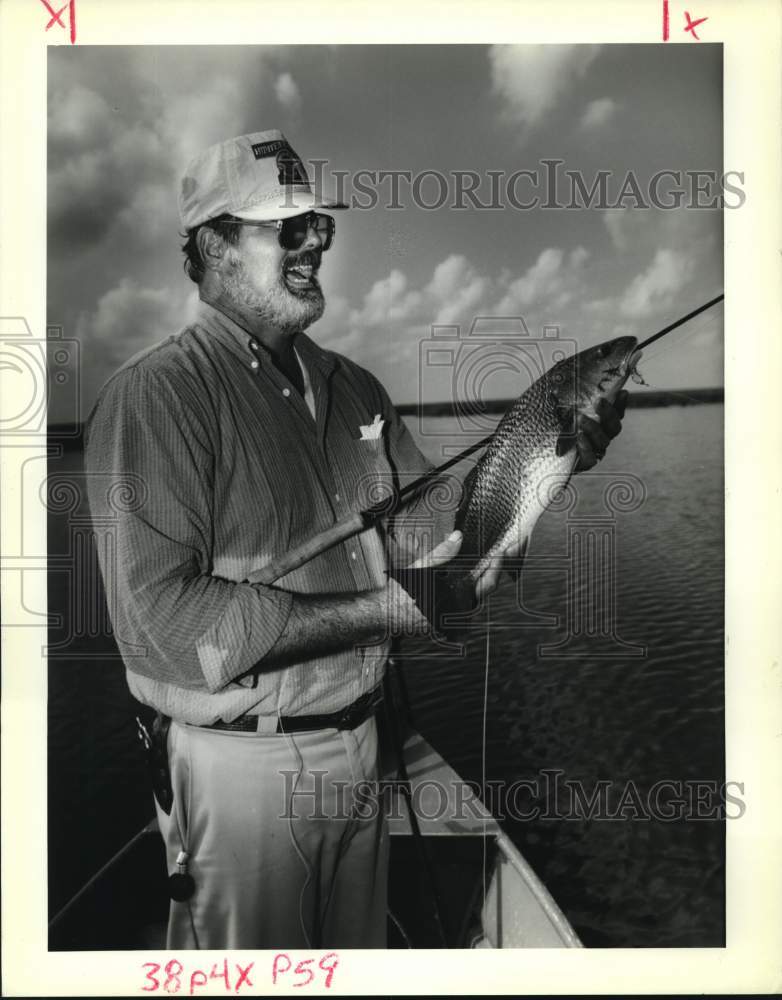 Press Photo Venture Sports&#39; fisherman shows his large catch - noc51012- Historic Images