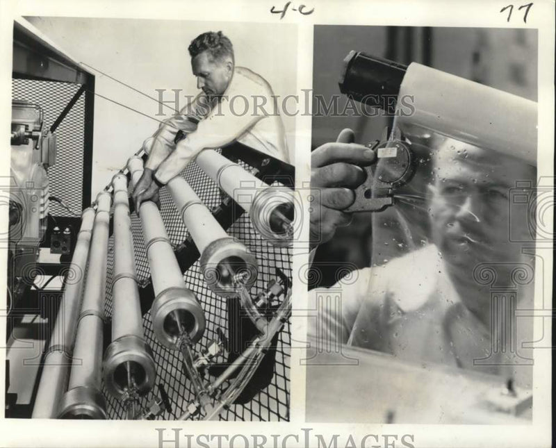 Load image into Gallery viewer, 1966 Press Photo Workman checks pressure tubes filled with acetate membranes.
