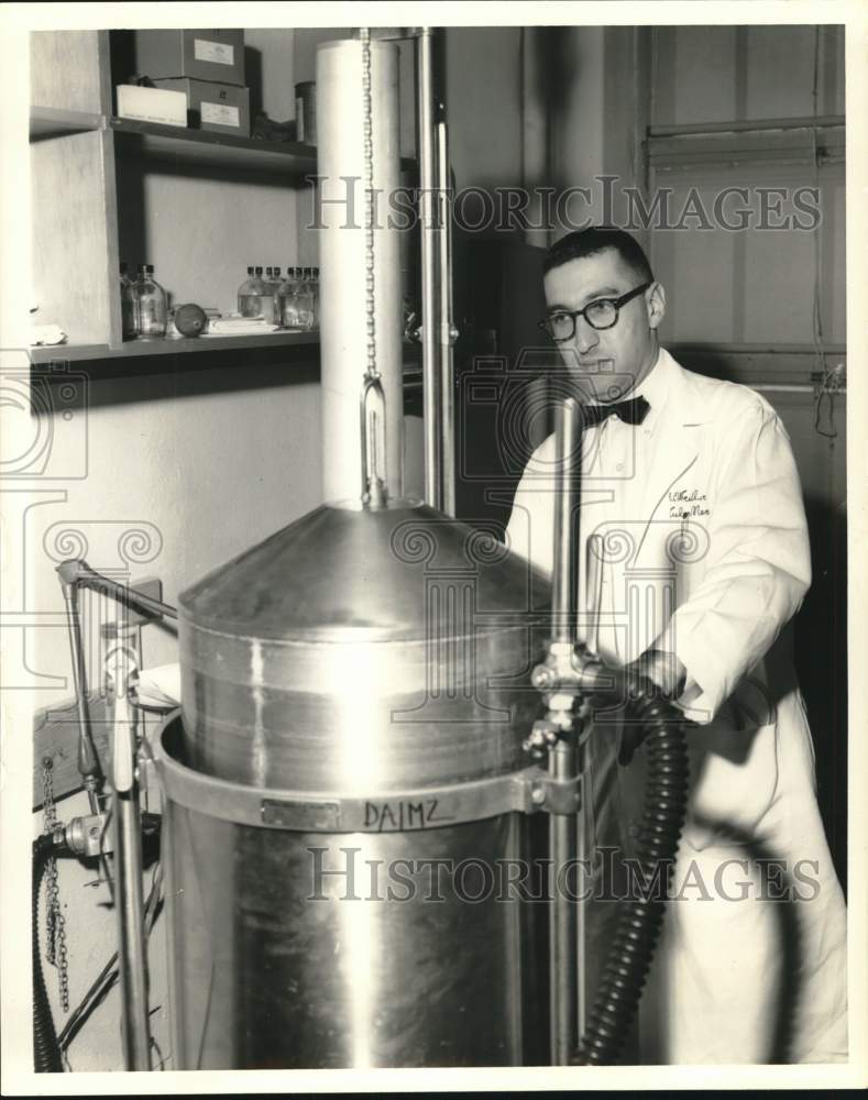 1961 Press Photo Dr. Hans Weill experimenting with the gasometer- Historic Images